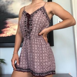 Patterned red romper with tie up tassles